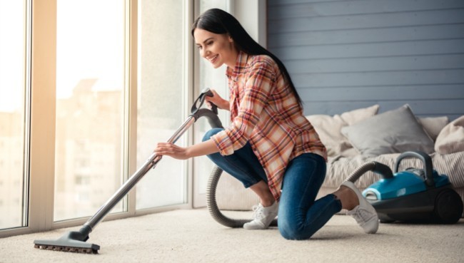 Lady cleaning carpet floor | Star Flooring & Design